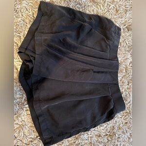 Lululemon. Not sure of the exact style. 2 back pockets.